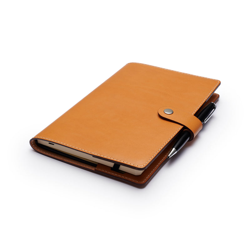 Personalized Tan Leather A5 Notebook + Pen on table